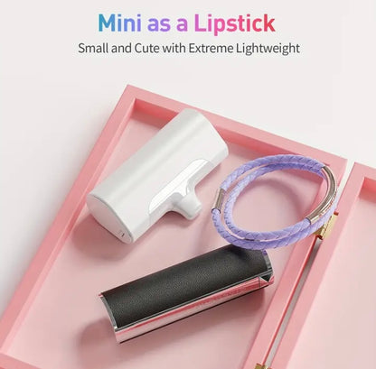 White Portable Mini iPhone Charger: "Compact and sleek white portable mini iPhone charger with LED indicator and Lightning connector."  Sky Blue Portable Mini iPhone Charger: "Vibrant sky blue portable mini iPhone charger with a modern design, featuring an LED indicator and Lightning connector."  Pink Portable Mini iPhone Charger: "Stylish pink portable mini iPhone charger, compact and lightweight, with an LED indicator and Lightning connector."