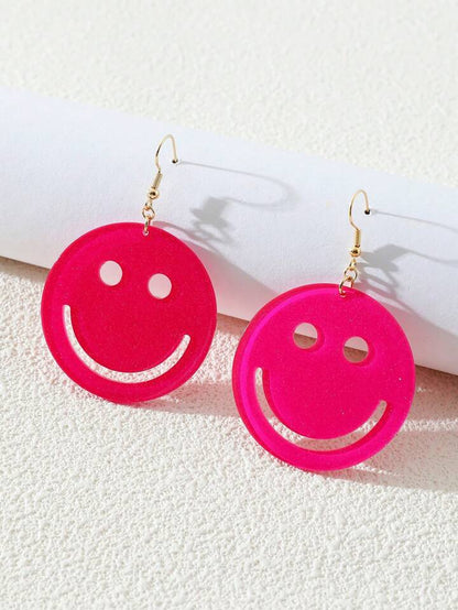 "Colorful acrylic smiley face earrings" "Playful smiley earrings for a cheerful look" "Acrylic stud earrings with smiley face design" "Vibrant smiley earrings for expressive style" "Quirky smiley face accessory in acrylic" "Lighthearted smiley earrings to brighten your day" "Acrylic drop earrings featuring smiley faces" "Statement earrings with joyful smiley motifs" "Funky acrylic earrings with smiley patterns" "Fun and fashionable smiley face ear studs"