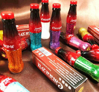 a close up of a stack of soda bottles 