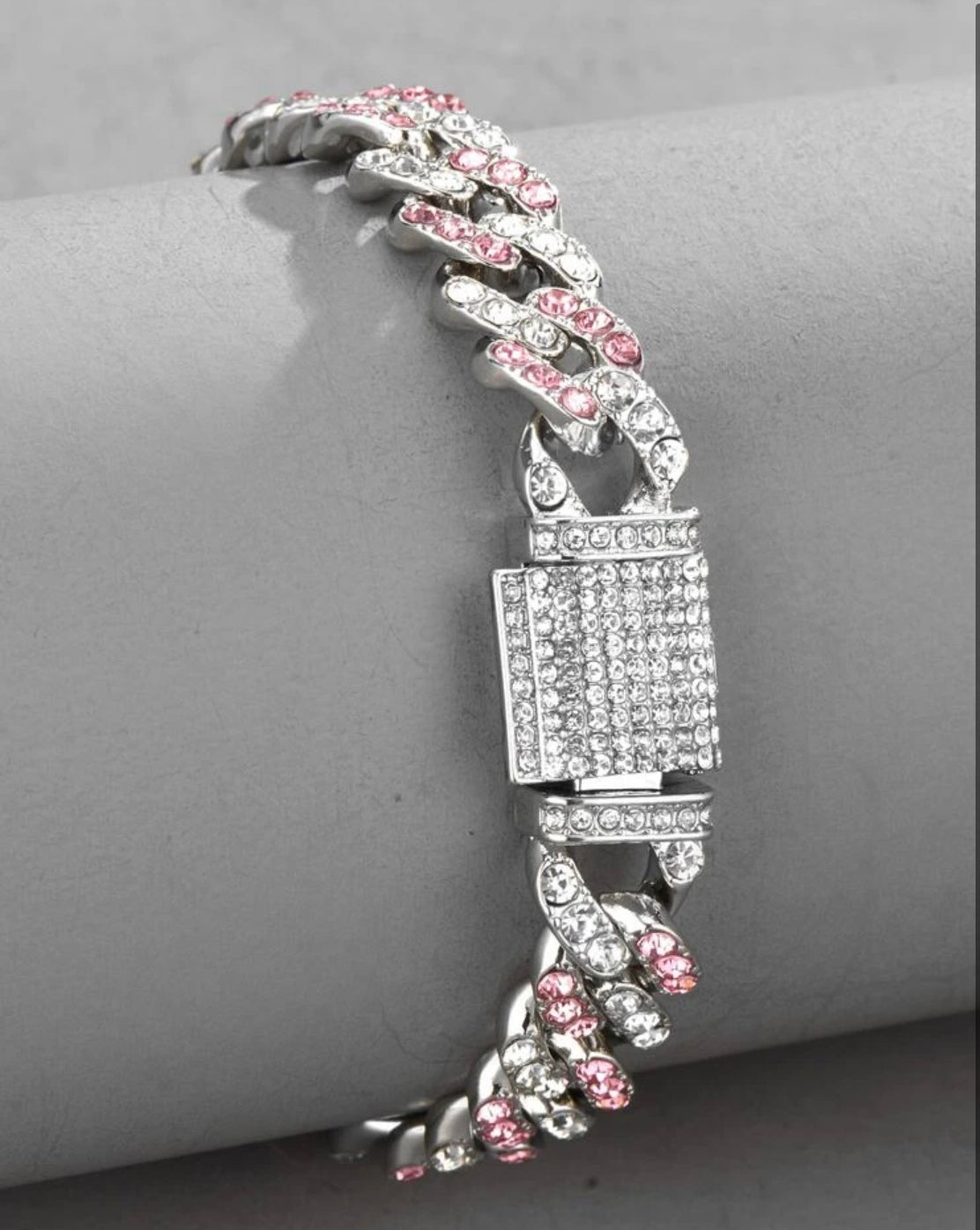 "Pink Cuban link bracelet" "Rose gold chain bracelet" "Feminine Cuban link jewelry" "Chic pink bracelet design" "Elegant Cuban link accessory" "Lustrous rose gold wristwear" "Statement pink chain bracelet" "Trendy pink link bracelet" "Fashionable women's jewelry" "Bold and beautiful pink wristpiece"